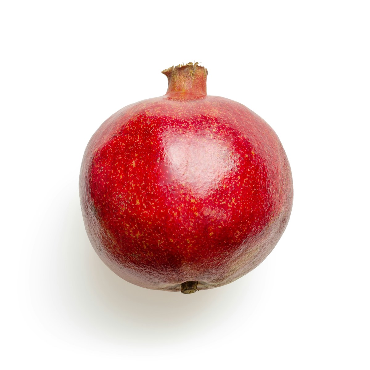 Whole red pomegranate with its characteristic crown